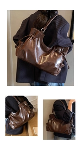 Detail of vintage brown tote bag with pleated texture and stylish drawstring closure