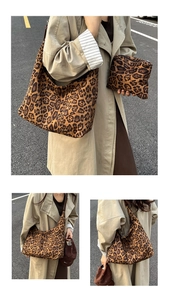 Detail of leopard print tote bag set featuring large hobo and matching small pouch