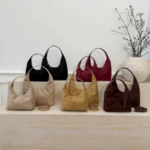 Retro dumpling style crossbody bags in multiple colors and sizes with a matte finish