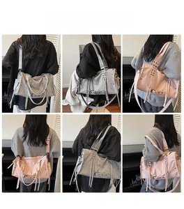 Detailed views of grey and pink retro large capacity tote bags shown from the back