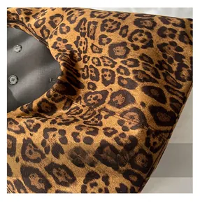 Close-up of leopard print tote bag with plush suede texture and precise zipper stitching