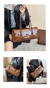 Detail view of a vintage brown baguette bag featuring a glossy texture and gold buckle