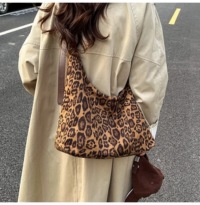 Leopard print tote bag detail showing high-quality suede texture and leather strap