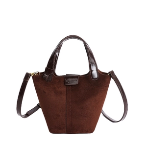Retro dark brown suede bucket bag with leather handles and adjustable shoulder strap