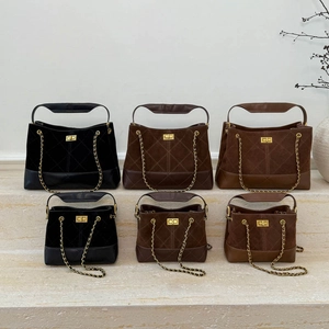 Detailed display of suede quilted chain bucket bags in multiple sizes and elegant colors