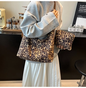 Leopard print tote bag and pouch set styled in a cozy cafe setting for daily commute