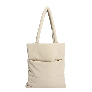 Minimalist beige quilted puffer tote bag with padded shoulder straps on white background