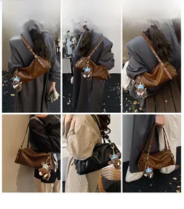 Detailed views of vintage cylinder shoulder bags in brown and black with bear charms