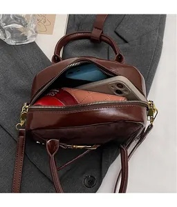 Internal view of the retro brown suede crossbody bag showing large storage capacity