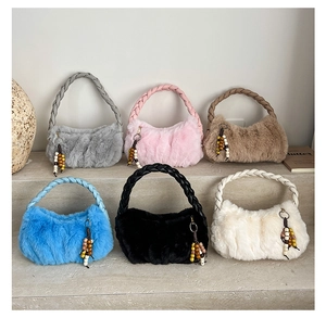 Close-up of six plush tote bags featuring woven handles and colorful bead decorations