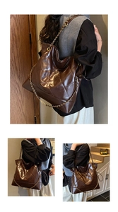 Detail of deep brown quilted tote bag with metal chain strap and glossy leather finish