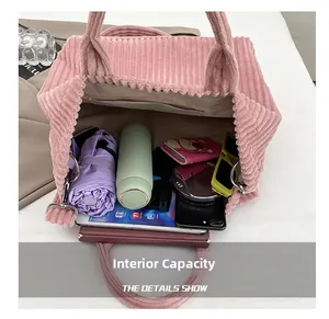 Pink corduroy tote bag showing large internal capacity with everyday essentials