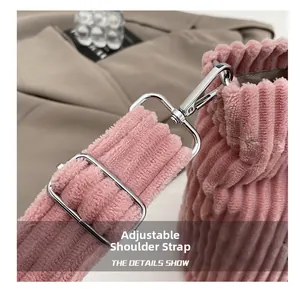 Close-up of pink corduroy tote bag showing adjustable silver metal strap buckle