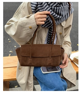 Deep brown matte suede tote bag shown on model with casual autumn outfit in natural light