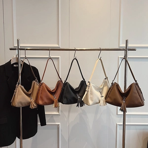 Minimalist tote bags in five earthy tones with pleated texture and stylish tassel charms