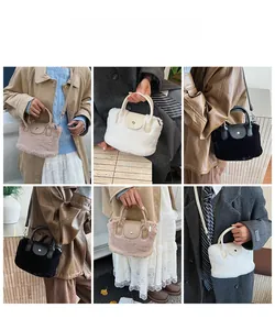 Detail of plush faux fur handbag with metal magnetic closure and detachable strap