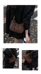 Detailed view of brown suede hobo bag with braided drawstring and metal infinity charm