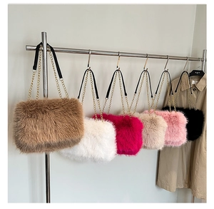 Detailed display of plush faux fur shoulder bags in multiple colors with gold chains