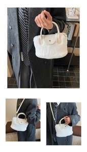 Detail of white plush faux fur tote with cream leather handles and silver metal hardware