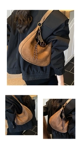 Detail of vintage brown suede hobo bag with braided tassel and adjustable strap