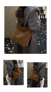 Detailansicht einer braunen Wildleder-Beuteltasche mit weißen Kontrastnähten und Gold-Hardware