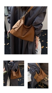 Close-up of brown matte tote bag featuring gold hardware and matching mini coin purse