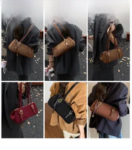 Retro baguette shoulder bag in brown, red, and black finishes with fringe tassel detail