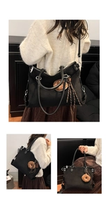 Black matte tote bag with plush donut charm and woven tassel shown in various carry styles