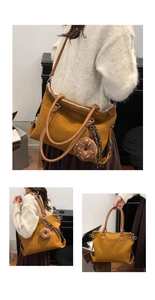 Detail view of large leopard tote bag in mustard yellow with donut plush charm
