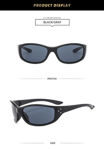 Detail view of black sport sunglasses with gray lenses and silver metal decorations