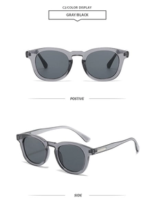 Detail view of vintage oval gray-black sunglasses with semi-transparent frames