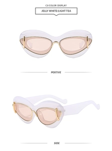 Détail de lunettes de soleil œil de chat blanc gelée avec ornements dorés et verres thé