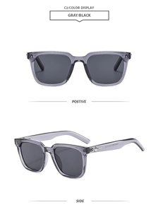 Detail view of square gray sunglasses with silver star accents and black lenses