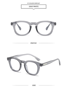 Close-up detail of stylish translucent gray oval frame sunglasses with metal side accents