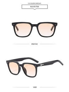 Detail view of retro square black frames with tea gradient lenses and star accents