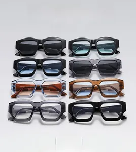 Close-up of geometric thick-framed sunglasses showing detailed specs on temple arms