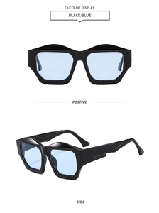 Detail view showing black polygon frame and blue transparent lenses of modern sunglasses