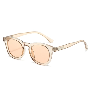 Retro champagne oval frame sunglasses with translucent orange lenses and metal detail