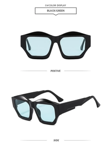 Detail view of irregular geometric black sunglasses with light green translucent lenses