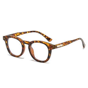 Retro tortoise shell round sunglasses with metallic hinge accents on white background