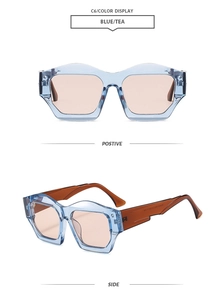 Detail view of stylish geometric sunglasses in light blue frames with brown tea lenses