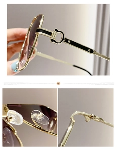 Détails de lunettes de soleil dorées avec verres dégradés et design de branche en fer