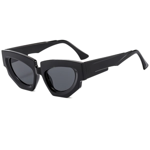 Fashionable geometric cat-eye sunglasses with thick black frames and dark grey lenses