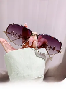 Detailed macro view of trendy sunglasses with purple gradient lenses and sparkling rhinestones