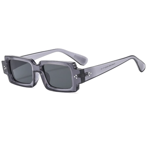 Vintage rectangle sunglasses with transparent grey frame and silver rivet details