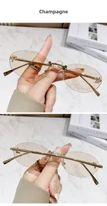 Detail of champagne rimless oval sunglasses with golden F logo metal temples