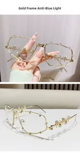 Close-up of gold metal irregular oversized frames with sparkling rhinestone embellishments