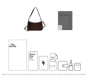 Detail showing spacious interior capacity of brown suede baguette bag with tassel