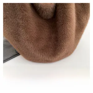 Close-up of premium leopard print faux fur material with soft fluffy texture detail