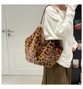Detail of leopard print faux fur tote bag showing soft plush texture and leather strap